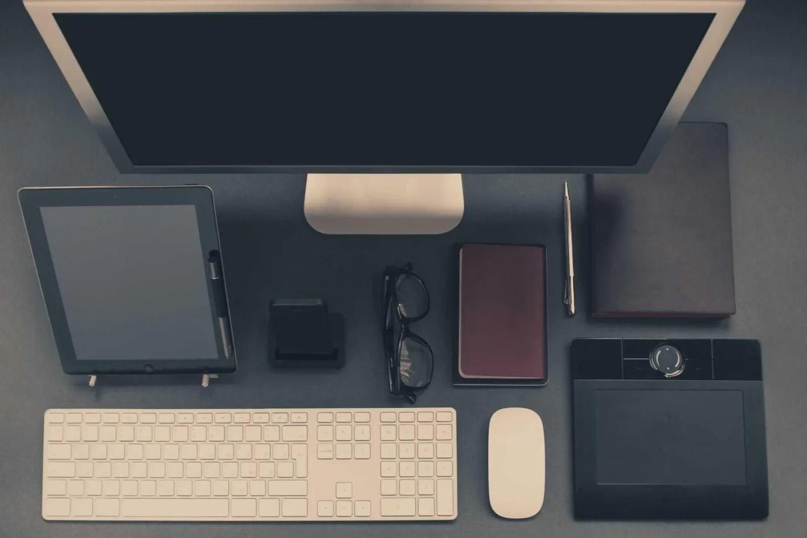 Work tools arranged neatly on a dark surface